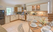 Gardener's Cottage - open-plan kitchen and dining area with stairs leading to the upper ground floor