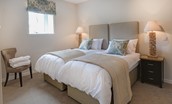 Granary - bedroom three with zip and link beds and side tables
