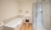 Halliburton - bedroom one en suite bathroom with bath, walk-in shower, WC and basin