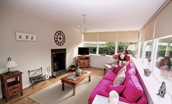 Kersmains Farm Cottage - sitting room/conservatory with fire