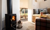 The Dovecot at Reedsford - relax with a drink in front of the cosy Salamander Hobbit wood burner