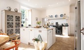 Honeystone House - bright open-plan kitchen and casual dining space with large oil-fired AGA and central island