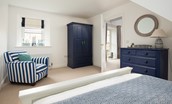 Samphire Barn - bedroom one with king size bed, chest of drawers and wardrobe