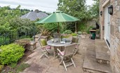 Boundary Bank - the raised terrace with barbeque and garden furniture