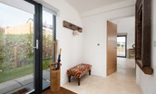 The Elm -  entrance door from the rear of the property into the spacious hallway with bench seating, coat hooks and umbrella stand