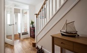 No. 6 - entrance porch with storage space and stair case leading to the first floor kitchen, dining area and sitting room