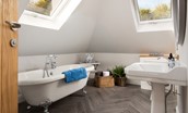 Greenhead Cottage - the first floor bathroom features a roll-top bath