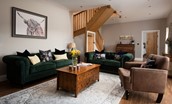 Granary View, Brockmill Farm - cosy sitting room with three-seater sofa, two-seater sofa, arm chair, coffee table, Smart TV and log burner