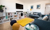 2 The Bay, Coldingham - the apartment boasts a selection of books and a 55" Smart TV with surround sound