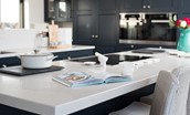 Seaside House - large kitchen island and breakfast bar with three stools