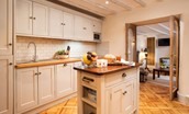 The Woodworker's Cottage - newly fitted kitchen with integrated appliances and access to the sitting room through the french doors