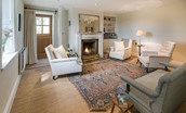 Overthwarts Farmhouse - drawing room with open fire