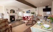 Anvil Cottage - open-plan living room and kitchen with dining space and wood burning stove