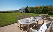 The Fairway - large lawned garden and patio with garden furniture and picnic bench