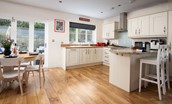 No. 6 - open plan, well-equipped kitchen with breakfast bar and two bar stools