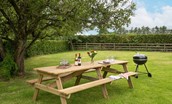 Pirnie Cottage - the picnic bench with charcoal barbecue in the garden