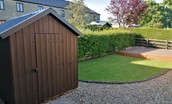The Haven - rear garden with garden shed, lawn and decking