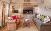 The Smithy, Crookham - sitting room with fire