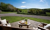 College Cottage - enjoy the stunning scenery from the outside furniture with a pot of tea