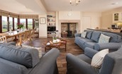 College Cottage - open-plan living area with dining space and wood burning stove