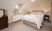 Bowmont Cottage - bedroom one with king size bed and views of the College Valley
