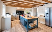 Crookhouse Mill - handcrafted Chalon style kitchen with island and door leading to the boot room