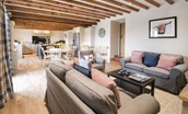 Crookhouse Mill - large open-plan space comprising kitchen, dining table and snug area with beamed ceiling