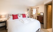 Crookhouse Mill - bedroom one on the ground floor with zip and link beds and en suite bathroom
