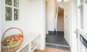 Garden Cottage - entrance hall with bench seating and hanging space