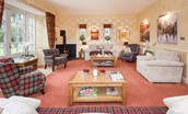 Dryburgh Farmhouse - comfortable seating for eight and access out to the large lawned garden through the double patio doors