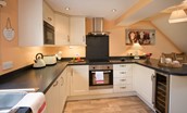Dryburgh Stirling Two - kitchen with breakfast bar and wine fridge