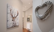 Barclay House - hallway with stag print and wicker heart