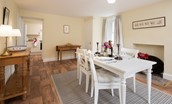 Gardener's Cottage, Elliston - dining room with dining table and two console tables