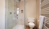 Dipper Cottage - bedroom one en suite bathroom with bath, walk-in shower, WC and basin