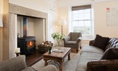 Dipper Cottage - cosy sitting room with inglenook fireplace and wood burning stove