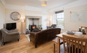 Dipper Cottage - sitting room with dining area seating six guests