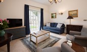 Beeswing - snug with sofas, armchairs and view of the garden