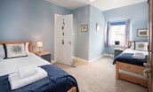 Crosslea - bedroom three on the first floor with twin beds and blue colour scheme