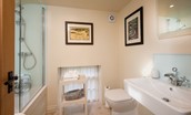 Countess Park - bedroom four en-suite bathroom with bath and shower over, WC and basin