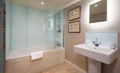 Countess Park - bedroom one en-suite bathroom with bath and shower over, basin and WC