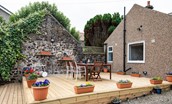 Calder Cottage - enjoy the sea views from the raised deck area with garden furniture