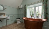Gardener's Cottage, Twizell Estate - free-standing copper bath in the family bathroom