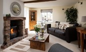 Rose Cottage, Huggate - the lounge with a cosy woodburning stove at its centre