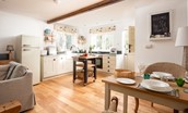 The Old Paper Mill - well-equipped kitchen in the open-plan living area