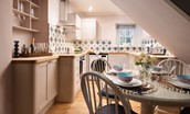 Bughtrig Cottage - with an open-plan living space, the cook of your party doesn't have to step away from the fun