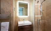 No. 6 - bedroom one en-suite with walk-in shower, heated towel rail, WC and basin with illuminated mirror above