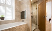 Number One Clayport Street - bedroom one en suite bathroom with bath, TV and en suite shower