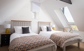 The Old School House - bedroom three features twin beds and a large Velux window
