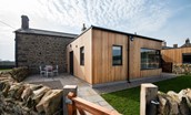Lakeside Cottage - Alice - rear aspect with outdoor seating area within the enclosed garden