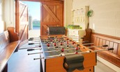 Hastings House - enjoy a game on table football in the games room with large barn doors that open onto the driveway